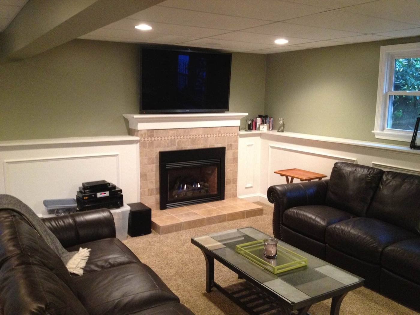 Finished basement family room with fireplace