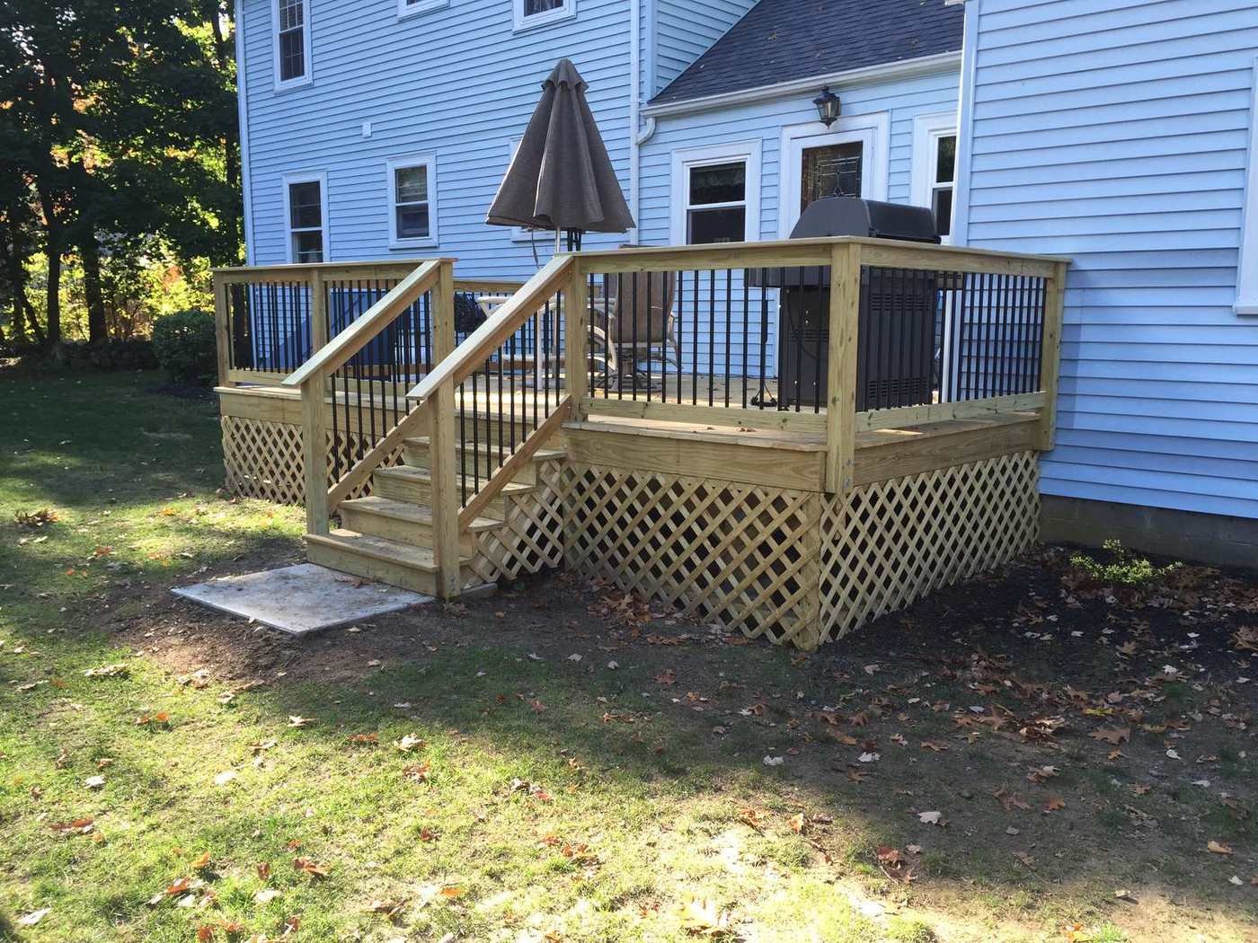 Pressure-treated deck with black balusters