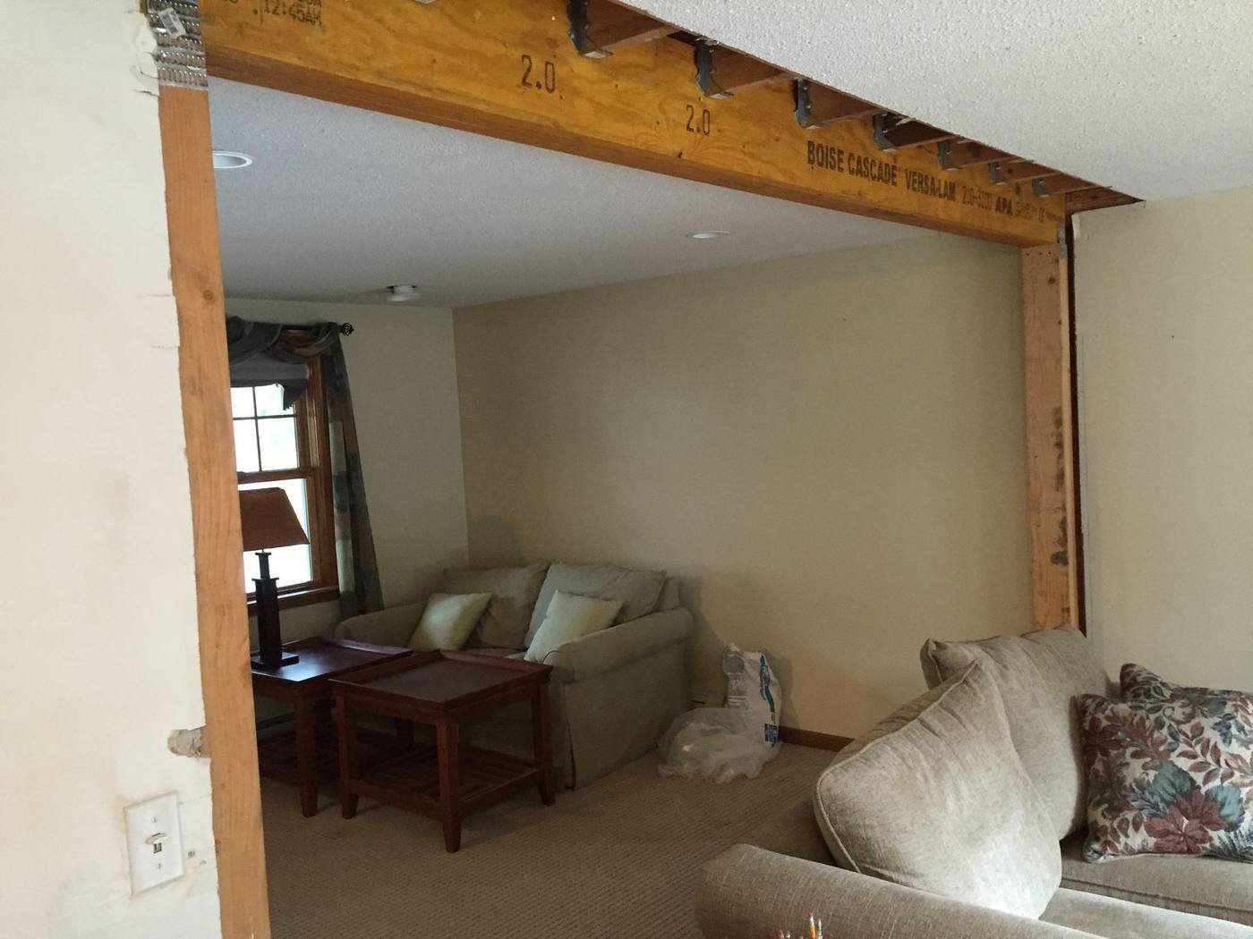 Engineered LVL beam carrying the load where a wall was removed