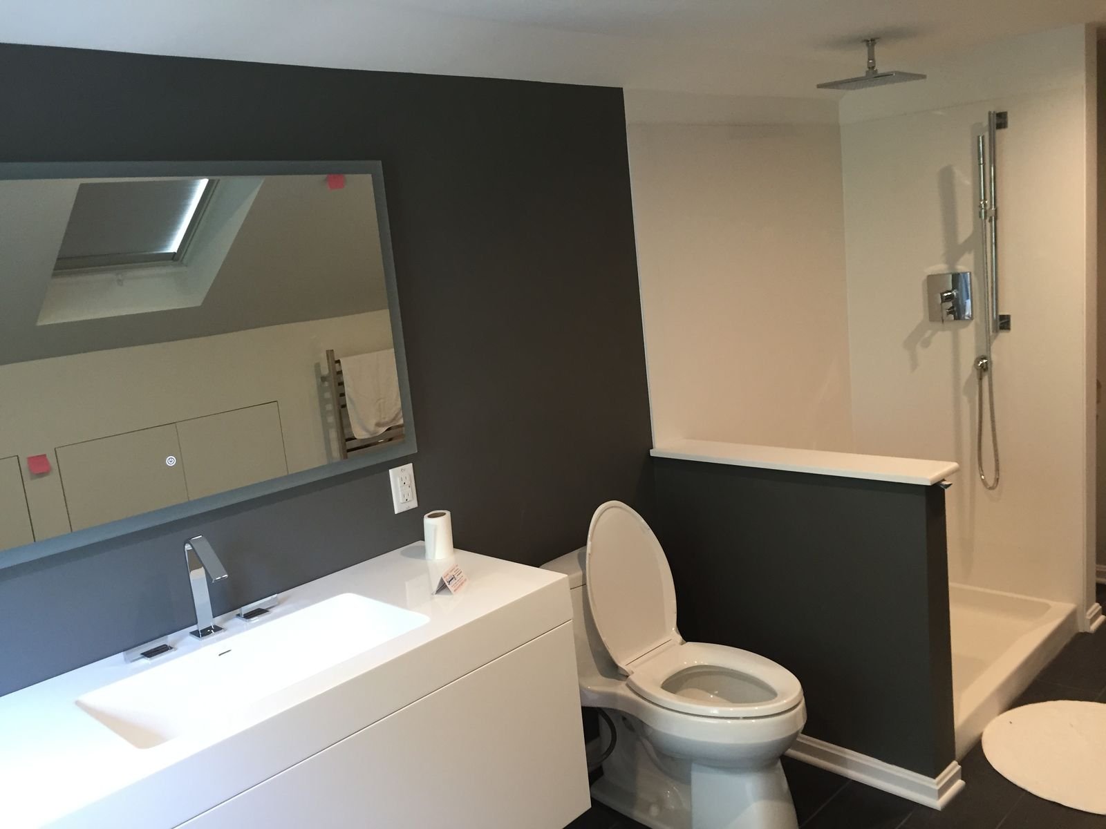 Second floor bathroom with trough sink and glass shower